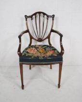 An Edwardian bedroom chair, with tapestry seat and carved detailing