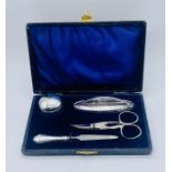 A cased hallmarked silver manicure set- replacement scissors