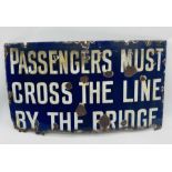 A railway related enamelled sign " Passengers Must Cross The Line By The Bridge" - Overall size 43cm