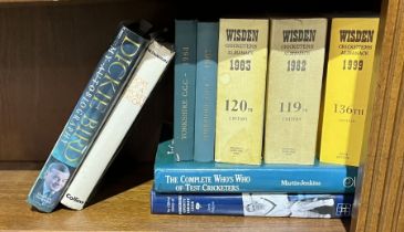 A small collection of books on the subject of cricket including 1982, 83 & 99 Wisden Almanack