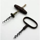 An antique Henshall type wooden handled corkscrew with brass shank along with one other