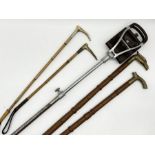 Two silver collared hunting crops along with a shooting stick and two brass handled walking sticks