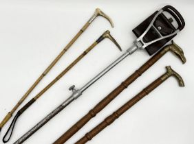 Two silver collared hunting crops along with a shooting stick and two brass handled walking sticks