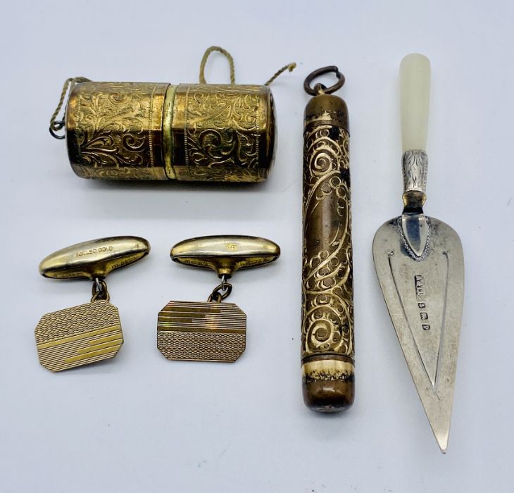 A hallmarked silver trowel shaped bookmark along with a propelling pencil, rolled gold cufflinks