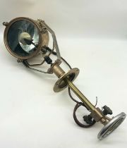 A brass ship's searchlight by Francis Searchlights, Bolton, with mirrored back and adjustable column