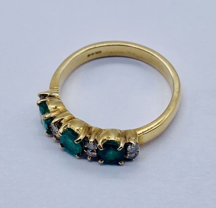 An 18ct gold emerald 3 stone ring set with 8 small diamonds - Image 2 of 3