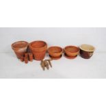 A quantity of various sized terracotta garden pots and one glazed - some A/F