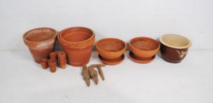 A quantity of various sized terracotta garden pots and one glazed - some A/F