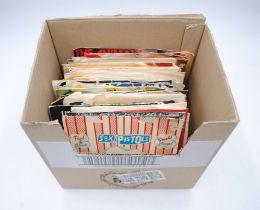 A quantity of various 7" vinyl records, including Queen, T. Rex, David Bowie, The Rolling Stones,