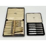 A boxed set of six silver handled knives etc.