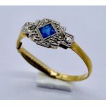 An Art Deco sapphire and diamond 3 stone ring set in 18ct gold with a 9ct gold sizing clip