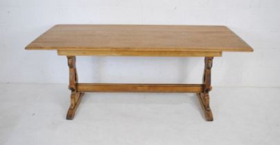 An Ercol oak refectory table - length 183cm, depth 82cm, height 76cm