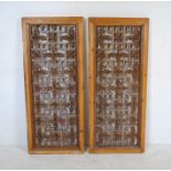 A pair of Chinese wooden window shutters, with carved and pierced floral decoration - 53.5cm x