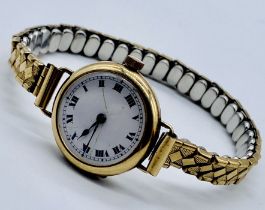 A 9ct gold wristwatch on expandable strap