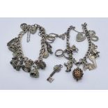 Two 925 silver charm bracelets with a variety of silver charms