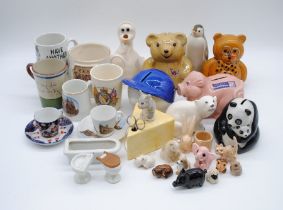 A quantity of various ceramics including a Wade tankard, Russian animal figures etc. over two