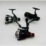 Three vintage fishing reels including two Abu Garcia Cardinal reels and a Shakespeare Sigma Supra