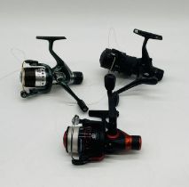 Three vintage fishing reels including two Abu Garcia Cardinal reels and a Shakespeare Sigma Supra