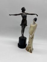 A resin Art Deco dancer (height 39cm) along with another figurine.