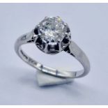 A diamond solitaire ring set in platinum, the diamond measuring 7mm diameter ( approx.1.2ct)