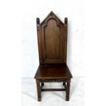 An oak gothic style hall chair.