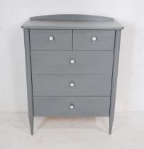 A modern grey painted chest of five drawers, raised on tapering legs - length 85cm, depth 46cm,