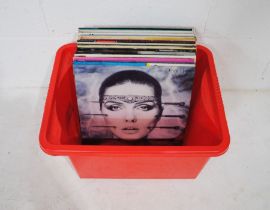 A collection of mostly 80's 12" vinyl records, including Debbie Harry, The Cars, Kim Wilde,