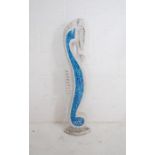 A decorative wooden figure of a seahorse with blue tiled mosaic decoration - height 99cm