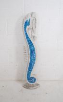 A decorative wooden figure of a seahorse with blue tiled mosaic decoration - height 99cm