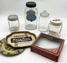 A collection of advertising and display items including Huntley & Palmers glass fronted tin, Riley's