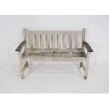 A 'Green Brothers Lister Teak' weathered garden bench with slatted seat - length 128cm, depth