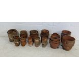 A collection of various sized terracotta garden pots