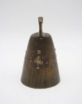 A bronze cow bell with broad arrow mark to either side