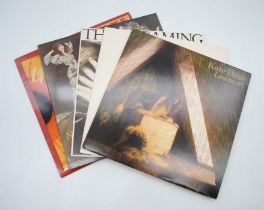 A collection of five Kate Bush vinyl records, comprising 'Lionheart', 'The Dreaming', 'Never for