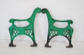 A pair of 19th century cast iron bench ends, with lion heads and hairy claw feet, marked 'B&B