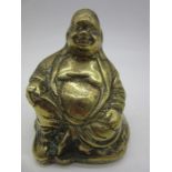 A vintage brass figure of Buddha, height 9.5cm
