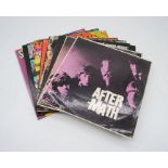 A collection of ten 12" vinyl records by The Rolling Stones, including 'After-math' (x2), 'Out Of