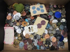 A collection of vintage buttons etc.