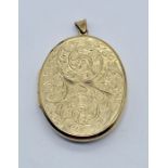 A 9ct gold locket with foliate design, total weight including glass 13.2g