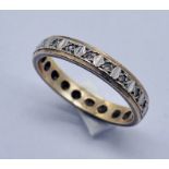 A 9ct gold eternity ring set with diamond chips. total weight 2.8g