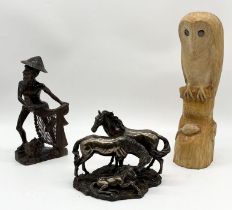 A Veronese resin figure group of two horses and a foal dated 2005 along with a carved wooden owl and