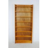 A pine freestanding bookcase - length 90cm, depth 19cm, height 204cm