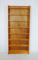 A pine freestanding bookcase - length 90cm, depth 19cm, height 204cm