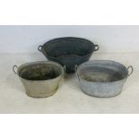 Three vintage galvanised baths