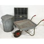 A galvanised lidded bin, wheelbarrow and foldable animal crate