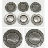A collection of antique pewter dishes along with two chargers marked for P & D London