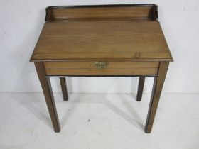 A Victorian pitch pine clerks desk with ebonised detailing