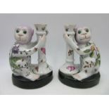 A pair of Chinese pottery candlesticks in the form of monkeys, height 20.5cm