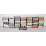 A collection of cassette tapes, including Pink Floyd, Led Zeppelin, The Beatles, The Rolling Stones,