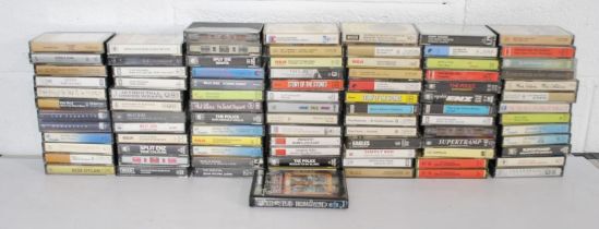 A collection of cassette tapes, including Pink Floyd, Led Zeppelin, The Beatles, The Rolling Stones,